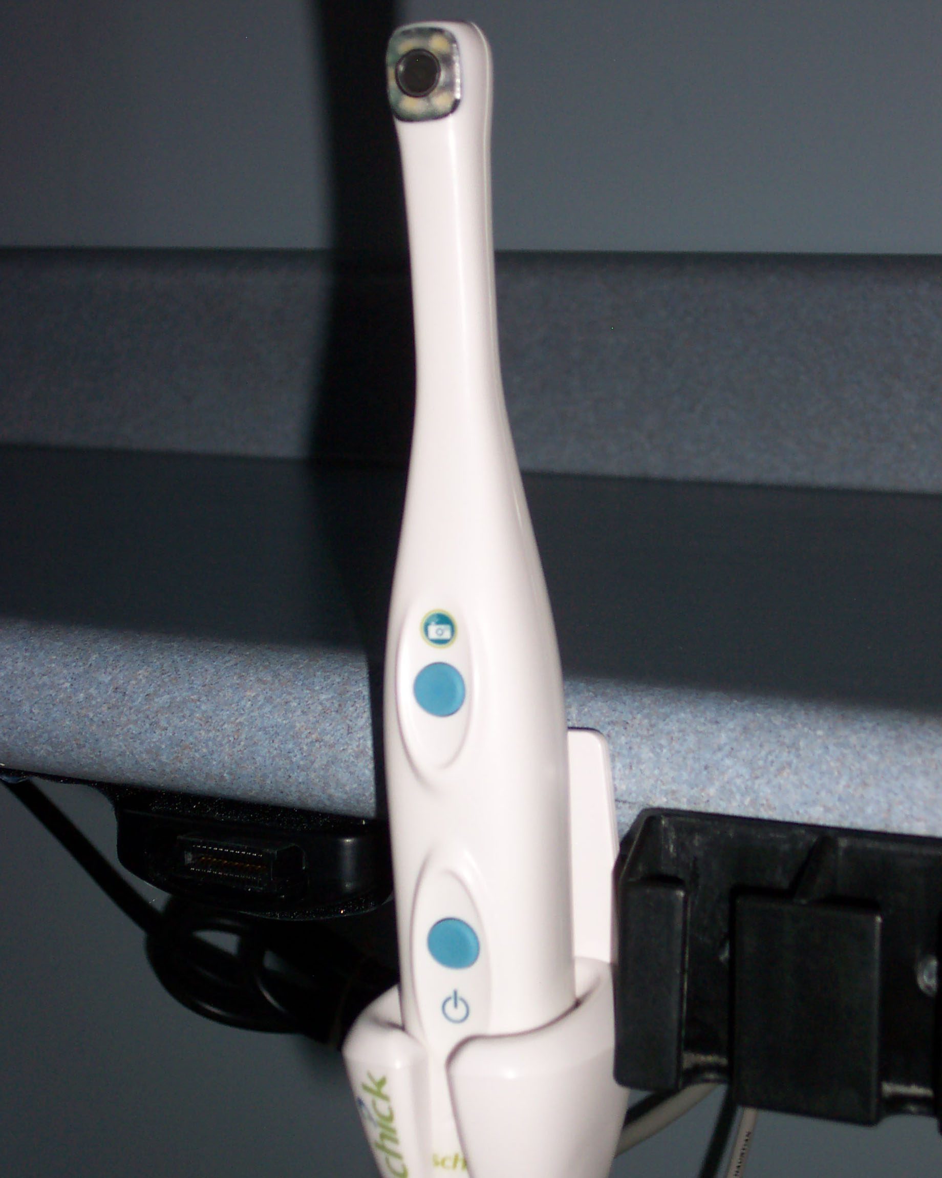 Intraoral Camera with blue power button at Terrance J. O'Keefe, DDS, LLC in Penfield, NY